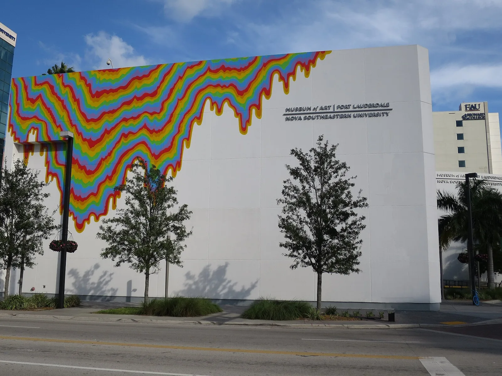 NSU Art Museum Fort Lauderdale on East Las Olas Boulevard, with a rainbow mural across its white wall.
