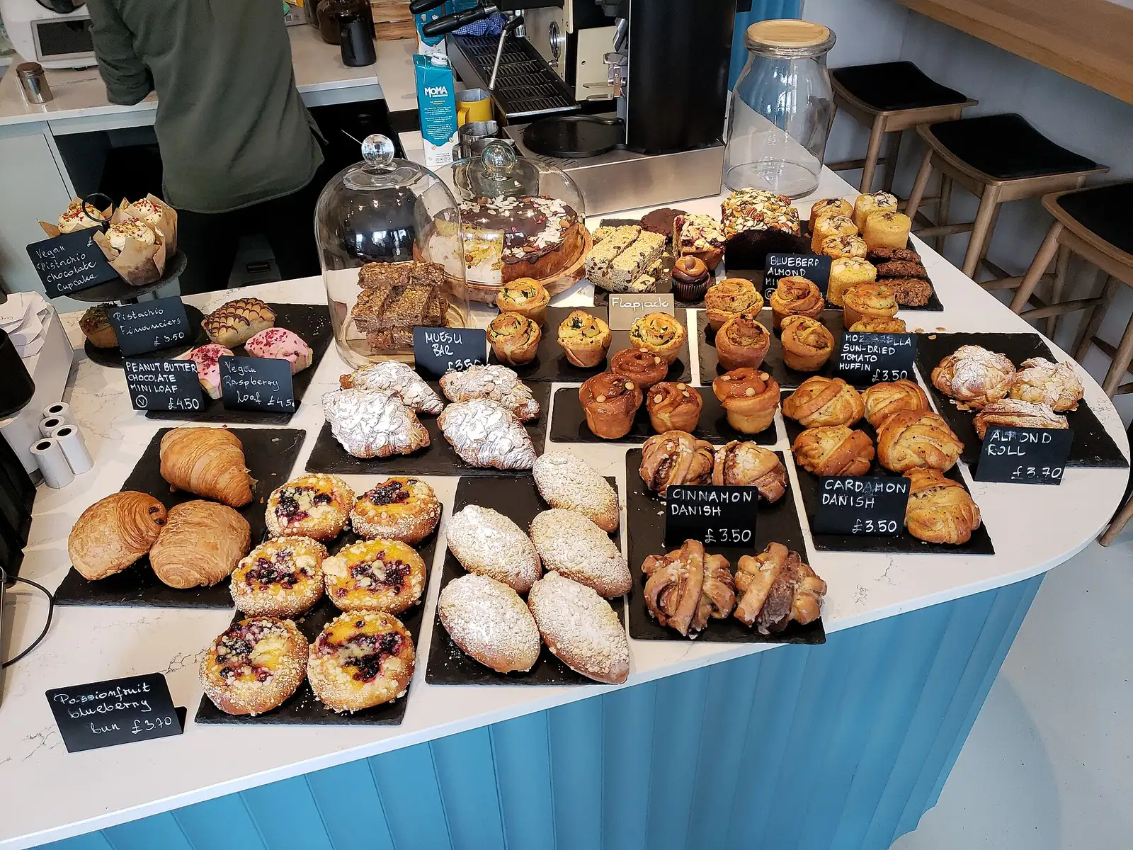Breads and pastries on a bakery counter. The photo was not taken at a Fort Lauderdale bakery.