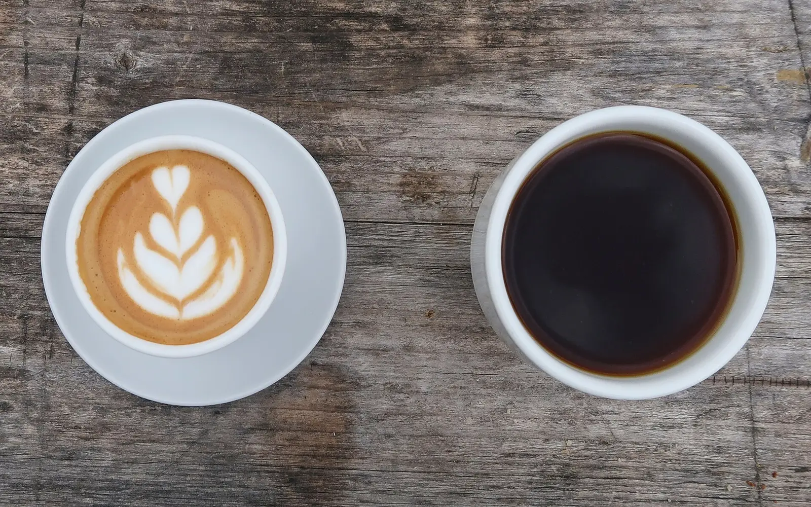 A latte and a cup of black coffee. The photo was not taken at a Fort Lauderdale cafe.