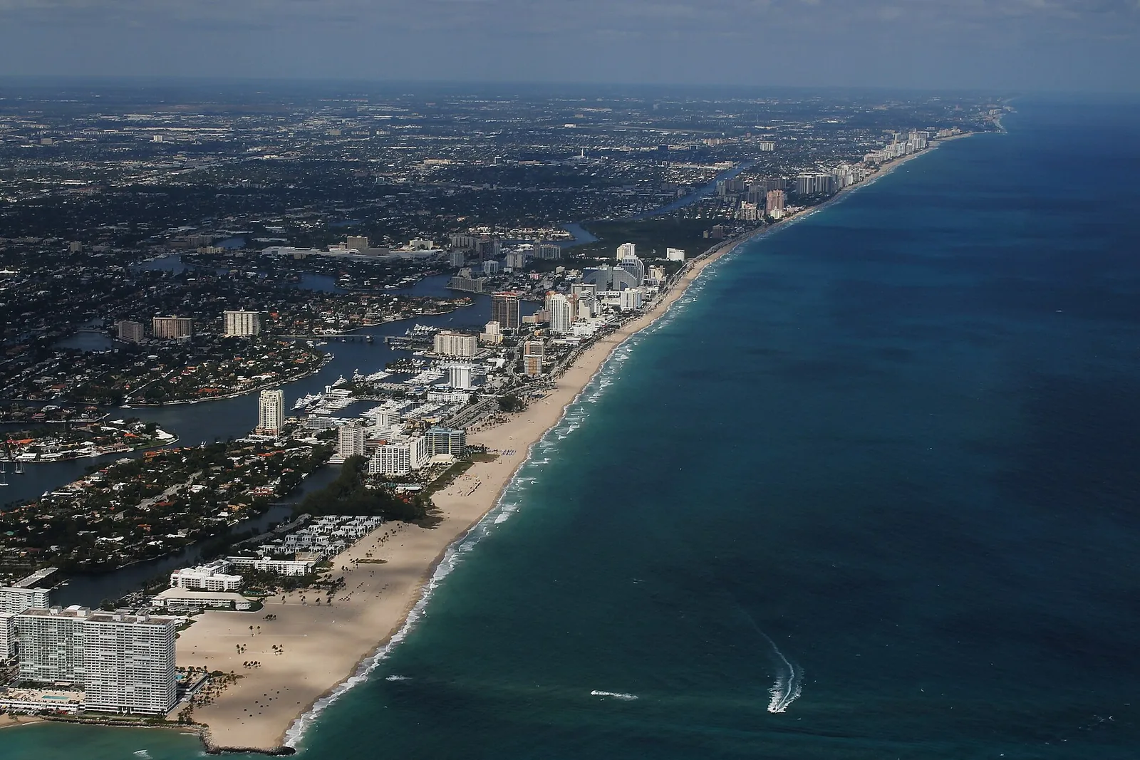 Fort Lauderdale's beach and barrier island from the air, looking north from Port Everglades Inlet.