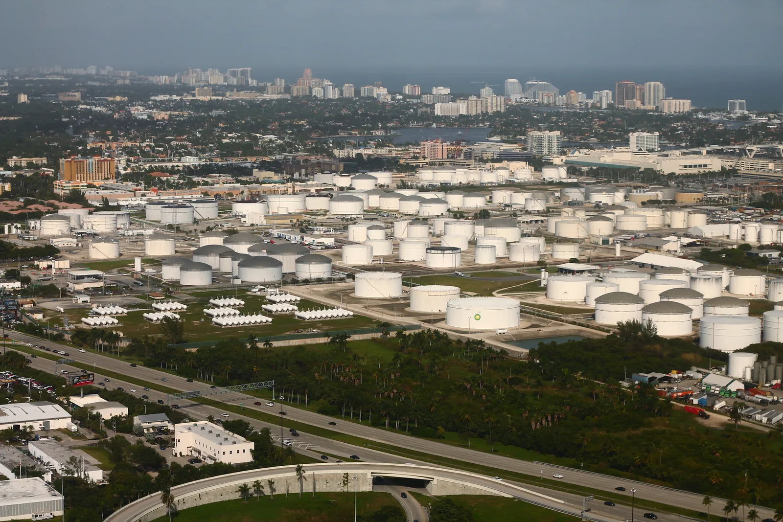 Fuel storage tanks at Port Everglades, with Fort Lauderdale and the ocean beyond.